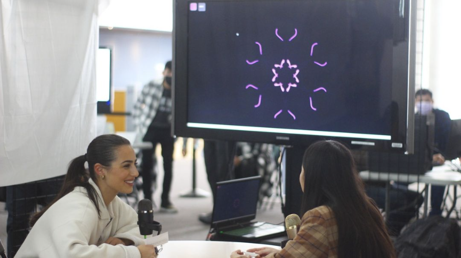 Two particiants having a conversation to have their voices converted into a kaleidoscope